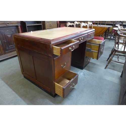 25 - A mahogany and leather topped library desk