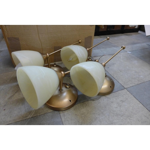 258 - A set of four gilt metal wall lights