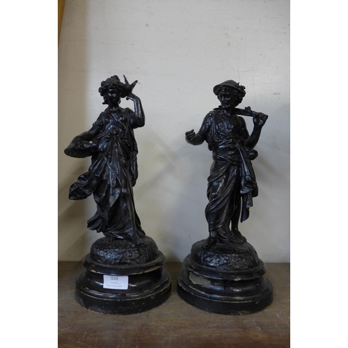 328 - A pair of late 19th/early 20th Century French spelter figures, on ebonised socles