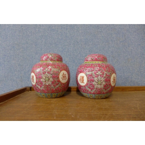 343 - A pair of small Chinese famille rose porcelain ginger jars and covers