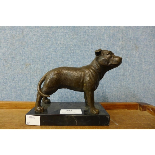 345 - A small bronze Staffordshire bull terrier, on black marble socle