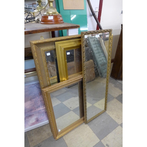 349 - Four gilt framed mirrors