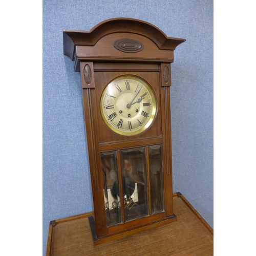 354 - A 19th Century mahogany wall clock, movement stamped D.R.G.