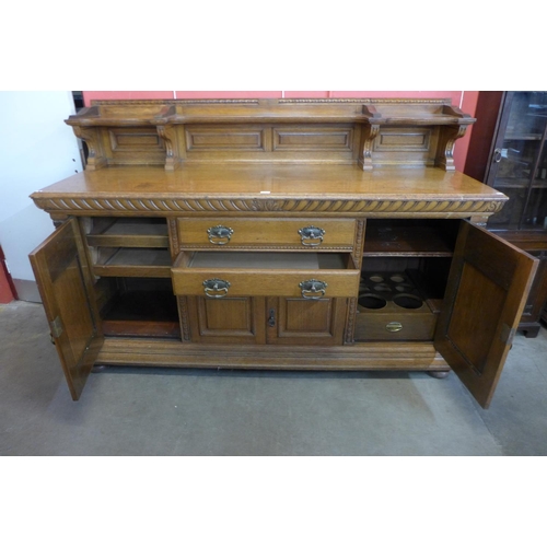 4 - A large Victorian carved oak sideboard