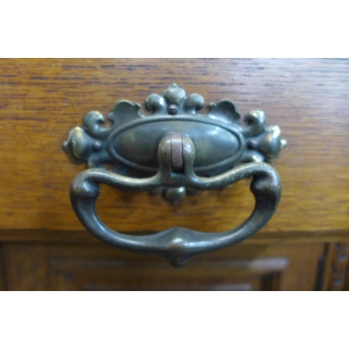 4 - A large Victorian carved oak sideboard