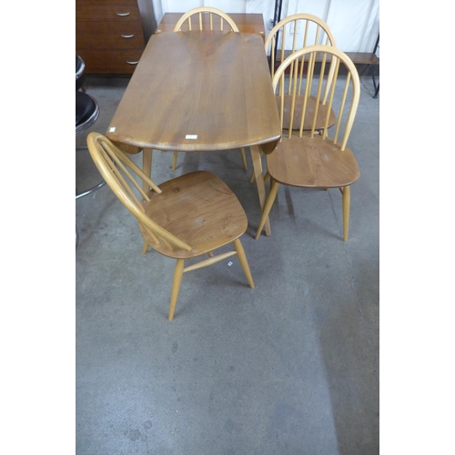 53 - An Ercol Blonde elm and beech Windsor drop-leaf table and four Windsor chairs