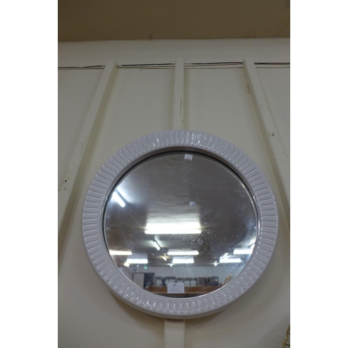 59 - A mid 20th Century white ceramic framed circular mirror