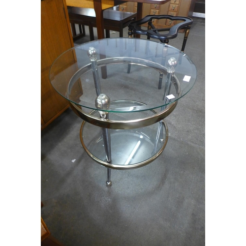 85 - A chrome and glass two tier circular occasional table