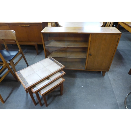 86 - A teak bookcase and a teak tiled top nest of tables