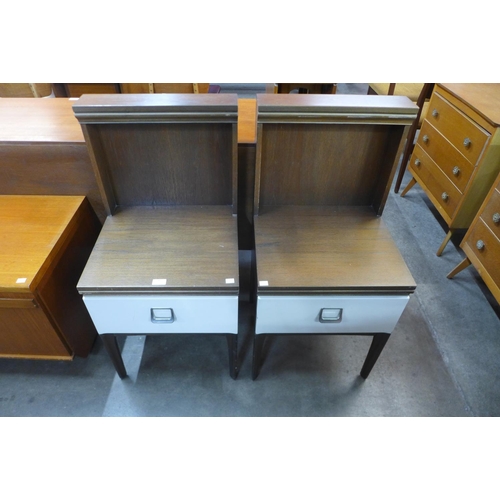 91 - A pair of William Lawrence teak and white laminated bedside tables