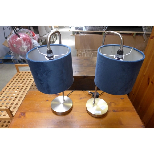 1835 - A pair of metal contemporary style table lamps with blue velvet shades