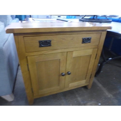 1581 - A Rustic oak 2 door small sideboard (NC-SMS-OAK)  *This lot is subject to VAT