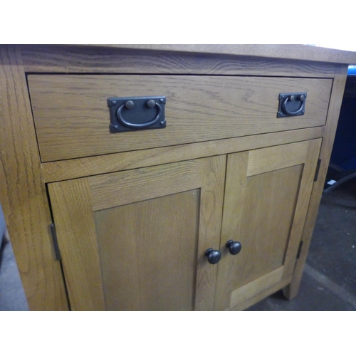 1581 - A Rustic oak 2 door small sideboard (NC-SMS-OAK)  *This lot is subject to VAT