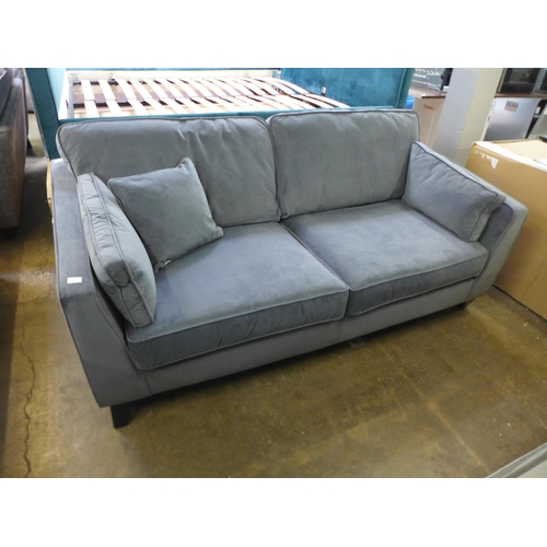 1583 - A steel blue velvet three seater sofa