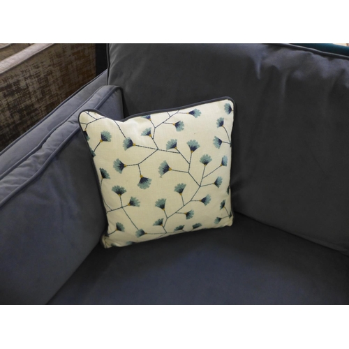 1583 - A steel blue velvet three seater sofa