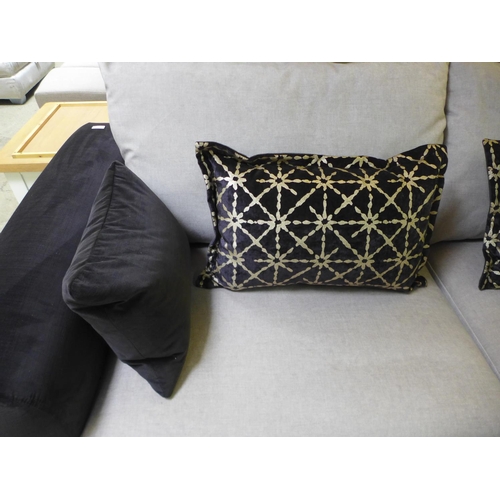 1589 - A black and taupe velvet three seater sofa on a timber frame