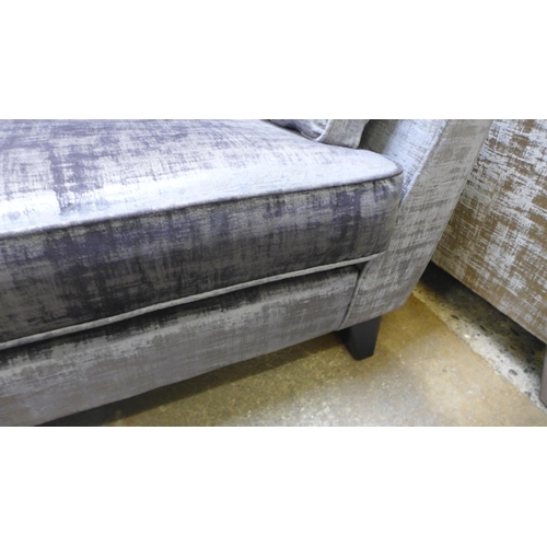 1594 - A silver and pewter velvet two seater sofa