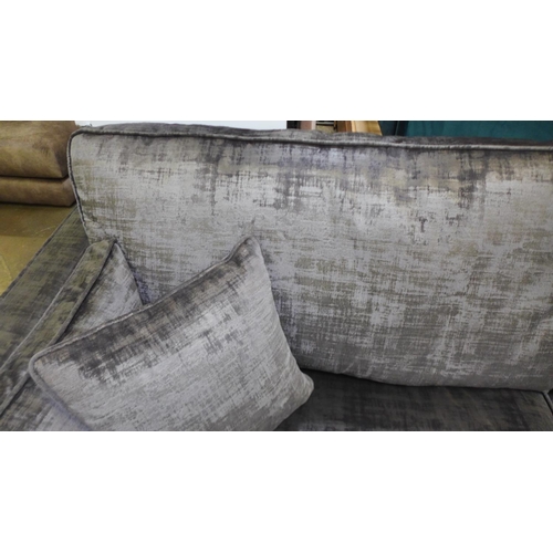 1595 - A silver and pewter velvet three seater sofa