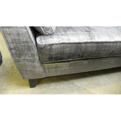 1595 - A silver and pewter velvet three seater sofa