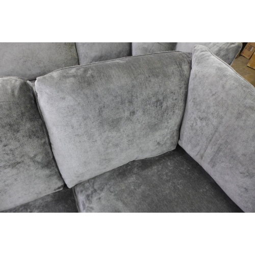 1601 - A pewter upholstered two seater sofa