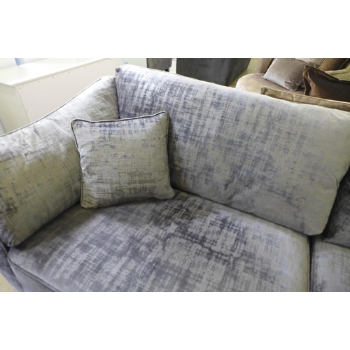 1604 - A silver and pewter velvet four seater sofa