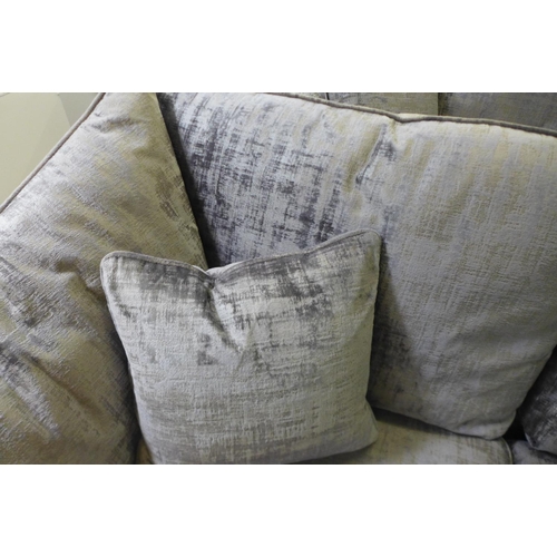 1605 - A silver and pewter velvet two seater sofa