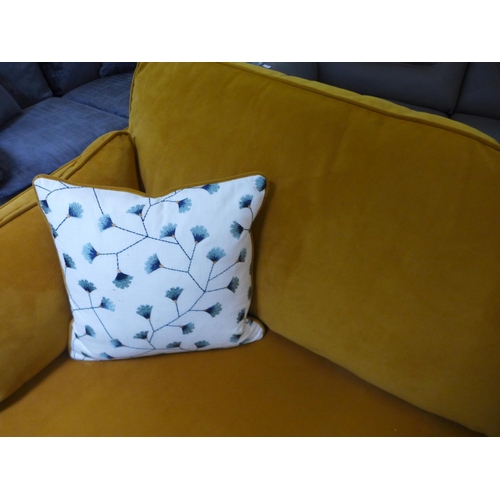 1609 - A turmeric velvet four seater sofa