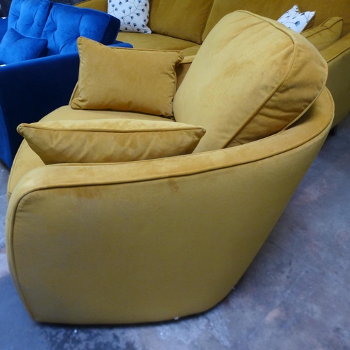 1610 - A turmeric velvet swivel armchair - mark on side