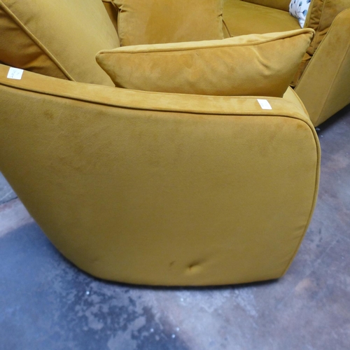 1610 - A turmeric velvet swivel armchair - mark on side