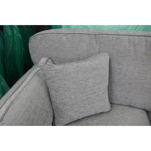 1661 - A light aquamarine upholstered three seater sofa