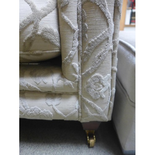 1729 - A floral and cream three seater sofa