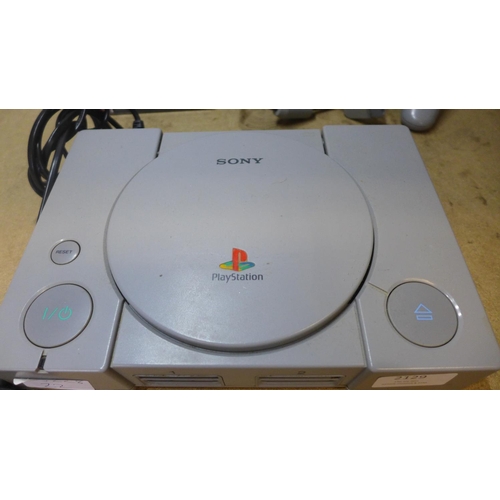 2129 - Playstation One console with qty. of games