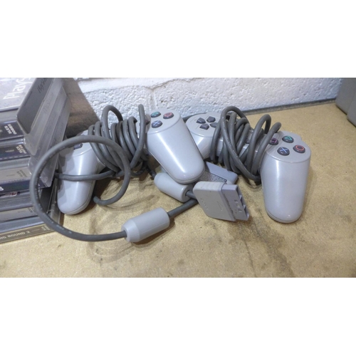 2129 - Playstation One console with qty. of games