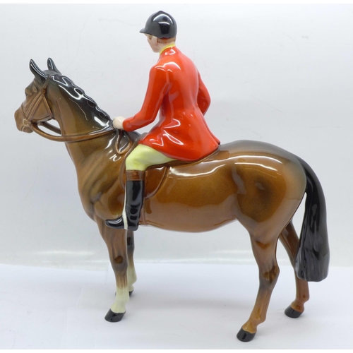 605 - A Beswick huntsman on horseback