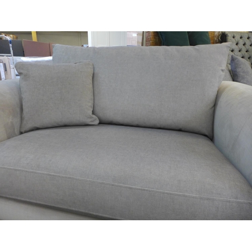 1397 - A taupe upholstered two seater sofa on a timber frame