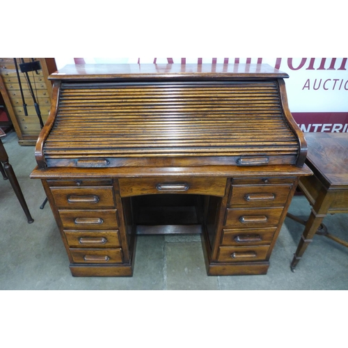 13 - An oak tambour roll top desk