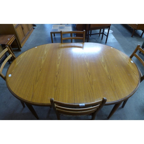 41 - A G-Plan Fresco teak extending dining table and four chairs