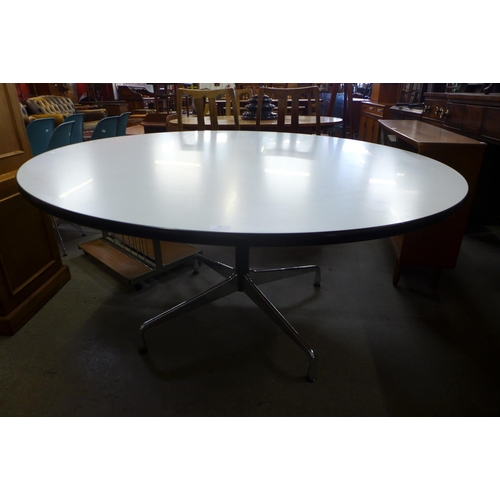 86 - A Charles & Ray Eames chrome and white laminated circular Vitra dining table