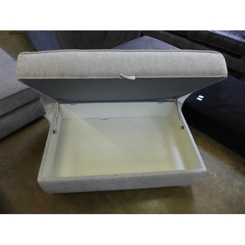 1570 - A grey upholstered storage footstool