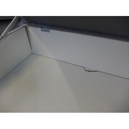 1570 - A grey upholstered storage footstool