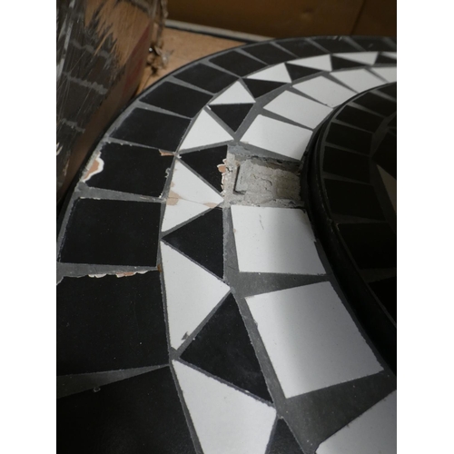 3168 - Black and white tiled fire pit * This lot is subject to VAT