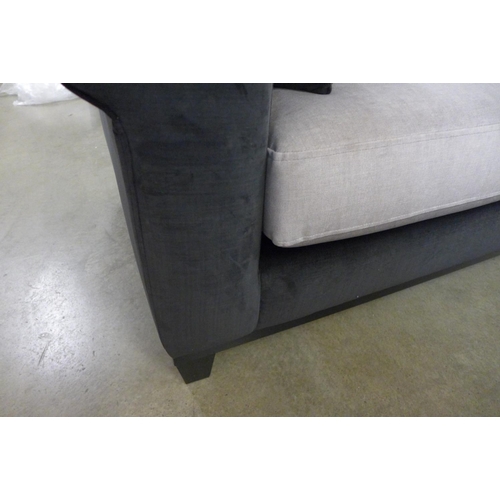 1402 - A black and taupe velvet three seater sofa on a timber frame