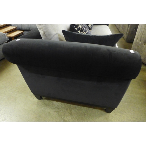 1402 - A black and taupe velvet three seater sofa on a timber frame