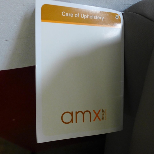 1551 - A Raffa grey leather two seater sofa