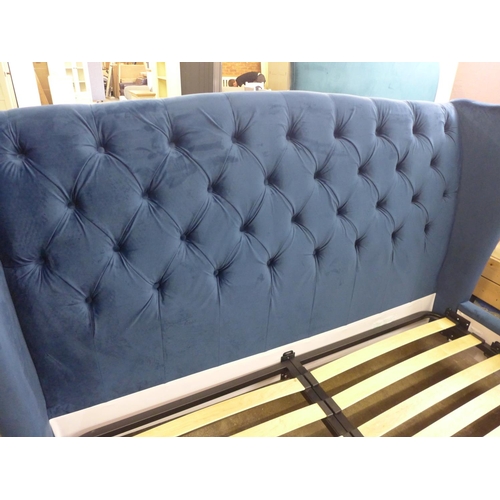 1566 - A superking blue velvet bedframe with buttoning and studwork