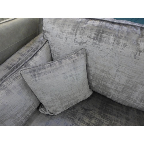 1569 - A silver and pewter velvet three seater