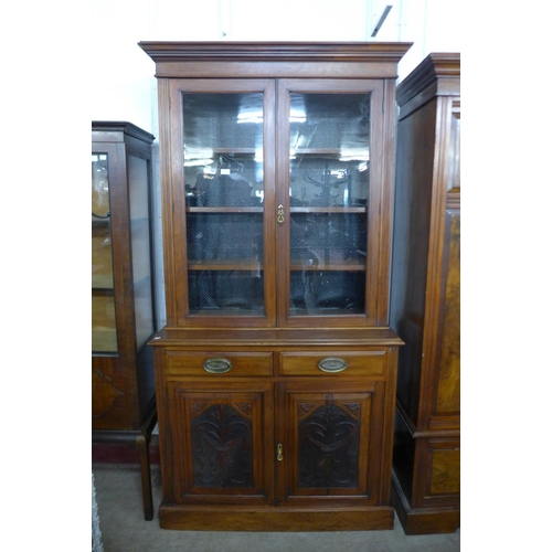 124 - A Victorian carved walnut bookcase