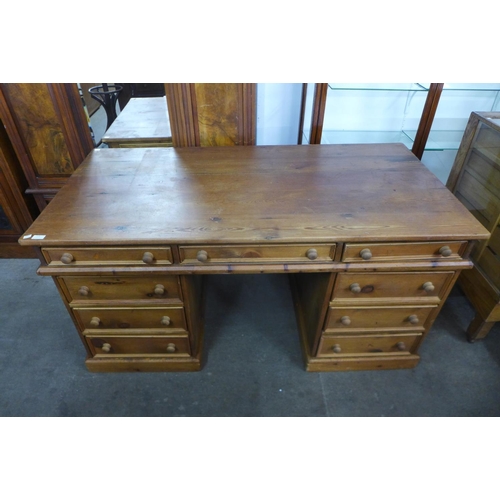 127 - A pine pedestal desk