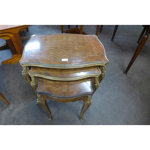 7 - A French Louis XV style parquetry inlaid rosewood and ormolu mounted nest of tables