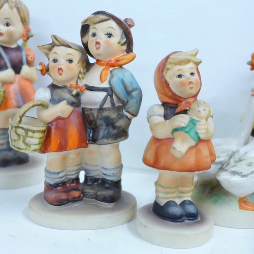 632 - Nine Hummel figures including Apple Tree Girl, Apple Tree Boy and Chimney Sweep